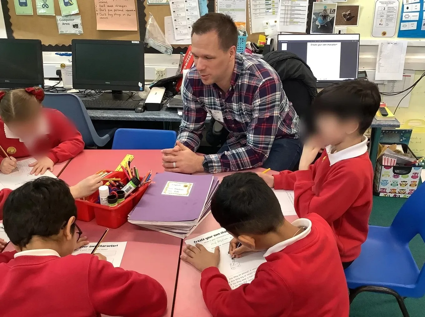 Matt Davies reading at a school for World Book Day 2026
